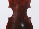 an old violin with a wooden back and a long neck