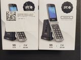 two boxes of cell phones sitting on top of a black table