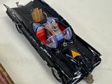 a toy boat with a man in it sitting on a table