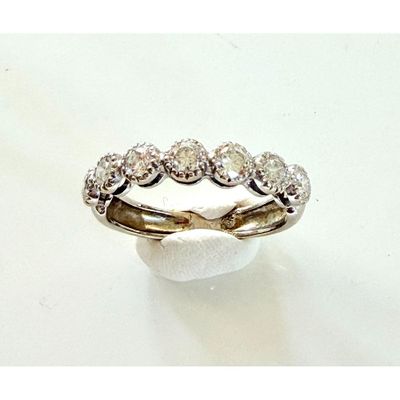 an image of a diamond ring on a white surface