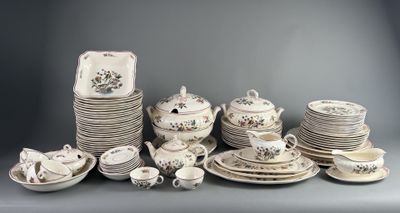 many plates and cups and saucers on the table