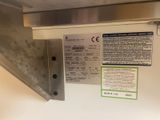 a close up of a metal shelf with a label on it