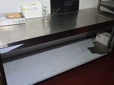 a metal table with a chalk board on top of it