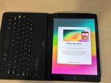 a tablet and a keyboard on a table