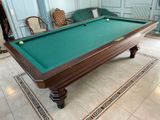 a pool table in the middle of a living room