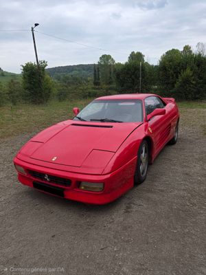 a red sports car parked in a parking lot