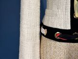 a close up of a jacket with a belt on a mannequin mannequin mannequin mannequin mannequin mannequin mannequin
