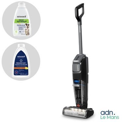 a close up of a vacuum cleaner and a bottle of cleaner