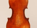 an old violin with a wooden back and a long neck