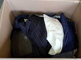 a box full of clothes and a hat in it