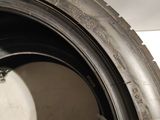 a close up of a tire on a white surface