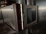 a microwave sitting on top of a counter in a kitchen
