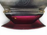 the inside of a black and red purse with a chain around it