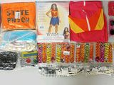 supplies laid out on a white surface including a red shirt, orange shirt, and other items