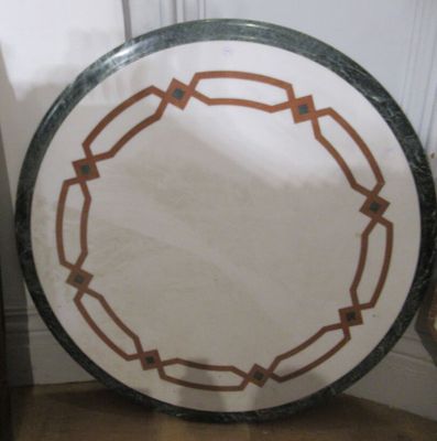 a white plate with a brown border sitting on the floor