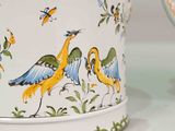 two vases that have birds on them on the table