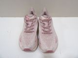 pink and white sneakers with pink laces on them on a white surface