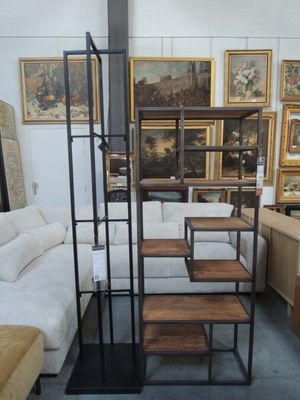 a room with a lot of furniture and pictures on the wall