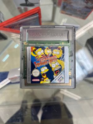 un jeu Nintendo dans un boîtier transparent posé sur une table