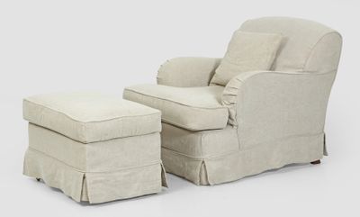 an image of a chair and ottoman with a cover on it