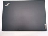 a laptop that is sitting on a white surface