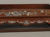 a small wooden box with flowers and birds on it
