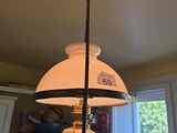 a lamp that is hanging from the ceiling in the kitchen