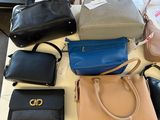 a lot of purses that are on the table