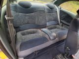 an image of a car seat with a remote control in it