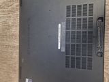 a laptop that is sitting on a wooden table