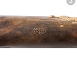 an old baseball bat with a wooden handle on a white background