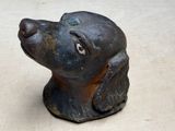 a statue of a dog that is sitting on a table