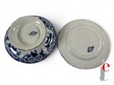 two plates with blue and white designs on them