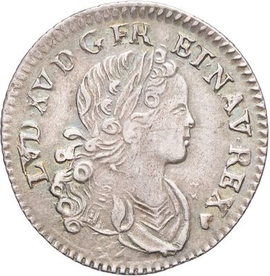 une pièce d'argent portant une tête de femme et une couronne
