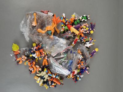 a lot of small toy figurines in a plastic bag