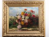 un tableau représentant un bouquet de fleurs posé sur un chevalet