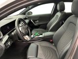 the interior of a car with a steering wheel, dashboard, and dashboard controls