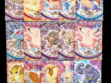pokemon trading cards are displayed on a table with a black background