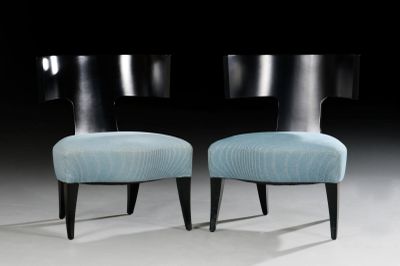 pair of black and blue chairs with blue upholstered cushions