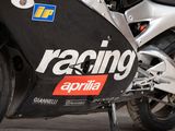 a close up of a motorcycle with a racing sticker on it