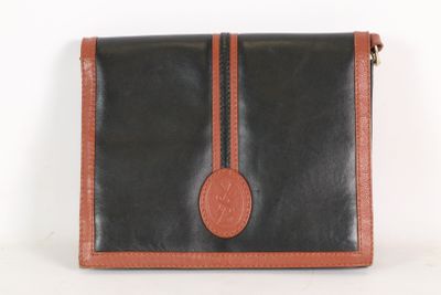black and brown leather purse with a brown leather strap