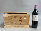 wooden wine box with a bottle of red wine in front of it