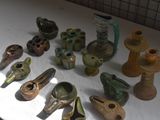 many different types of vases sitting on a table