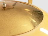 yellow table lamp with a metal base and a gold plated base