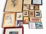 a lot of framed art on a white surface