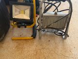 a light that is sitting on the floor next to some luggage