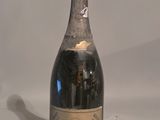 a bottle of wine that is sitting on a table