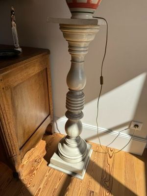 a lamp that is on top of a wooden table
