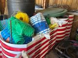 many different colored balls of yarn in a bucket