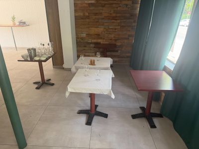 two tables that are sitting in the middle of a room